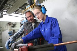 woman training to become a plumber