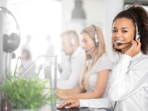 Call center worker accompanied by her team.