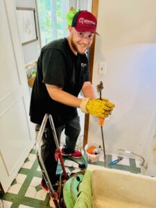 Enrique - Service Coordinator doing Snaking