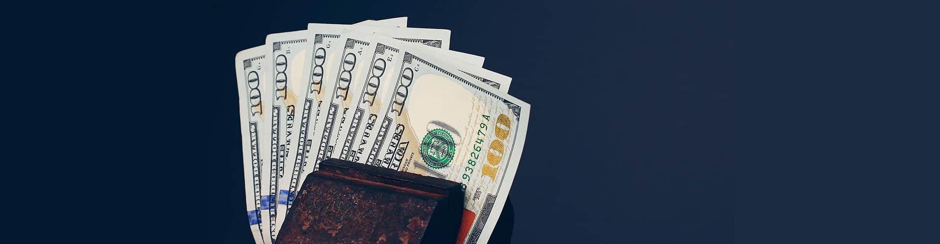 A couple of hundred dollar bills—financing banner