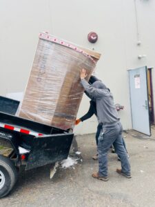 New Rinnai Tank Water Heater being carried