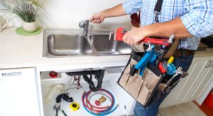 plumber doing renovations on kitchen