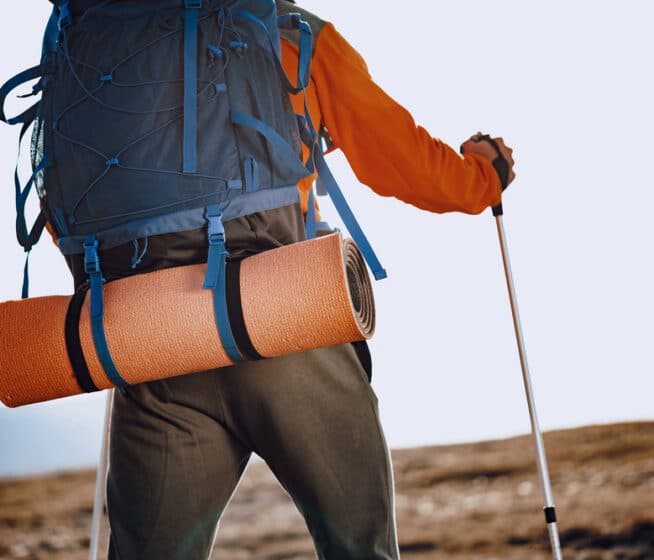 A person with backpack going on a hike