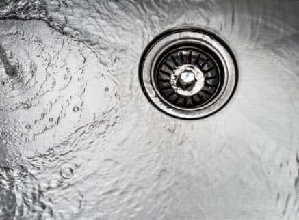 unclogging drains with hot water